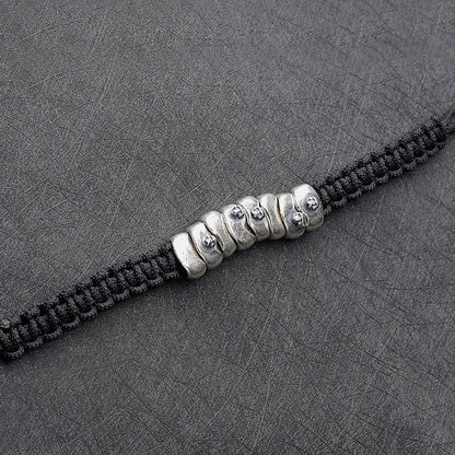 Bracelet tressé en corde de parachute argentée avec armure de crâne