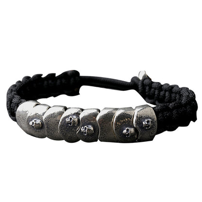 Bracelet tressé en corde de parachute argentée avec armure de crâne