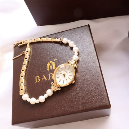 Montre à quartz exquise pour femme avec bracelet en perles d'eau douce naturelles