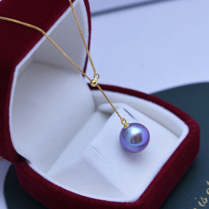 Colgante de perla de agua dulce de 12 a 13 mm con forma de círculo perfecto, color morado demonio, con defectos finos y muy claros