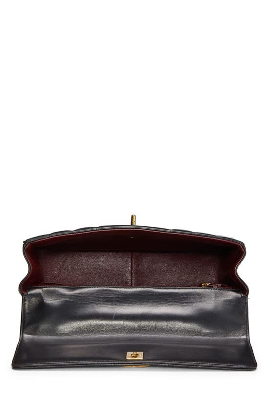 CHANEL, Sac Kelly vertical en cuir d'agneau noir d'occasion, Noir