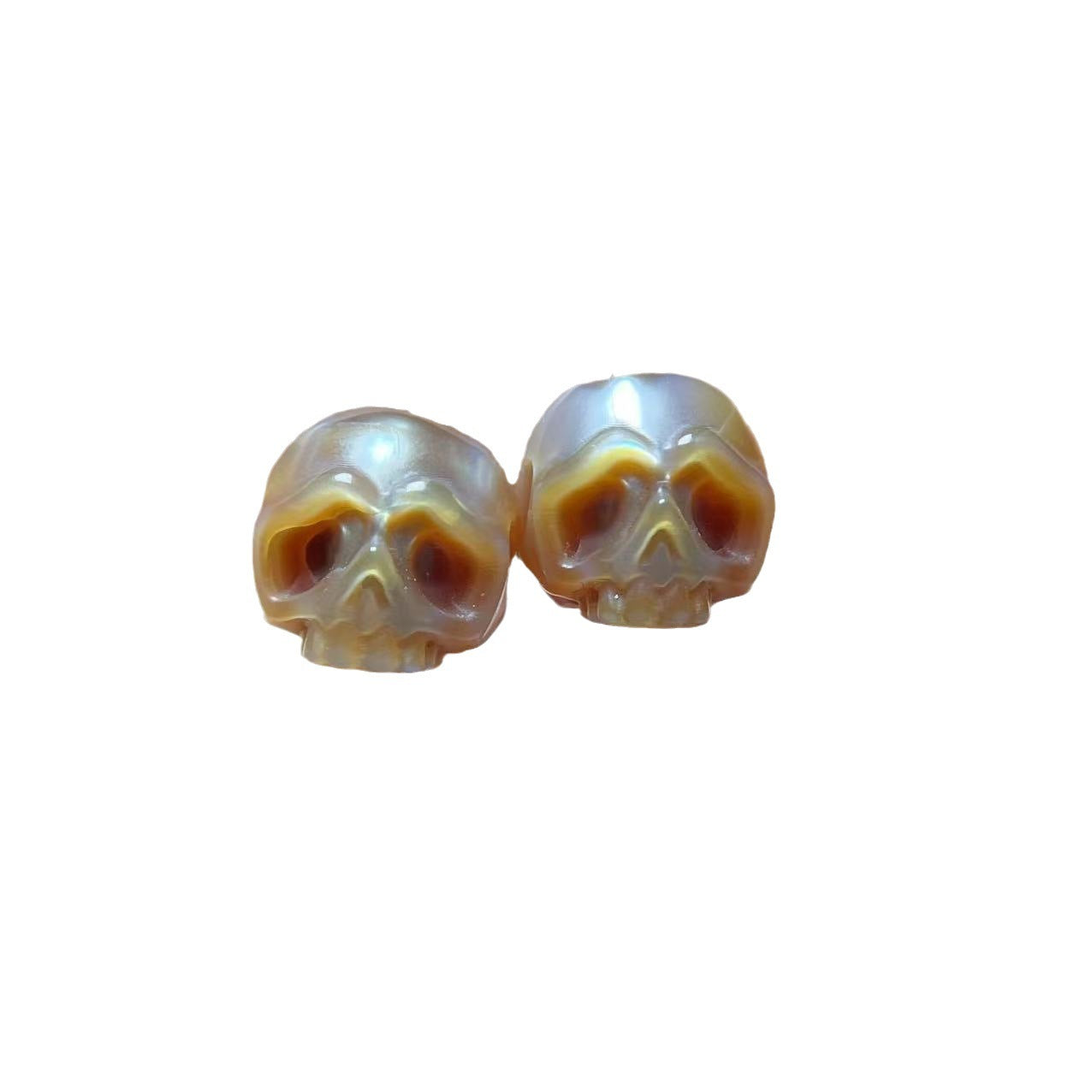 Pendientes de calavera con perla tallada