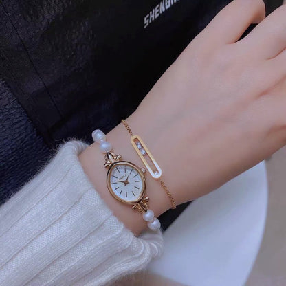 Montre à quartz exquise pour femme avec bracelet en perles d'eau douce naturelles