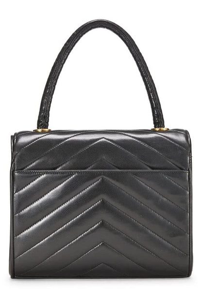 CHANEL, Sac à main en cuir d'agneau noir à chevrons d'occasion, noir