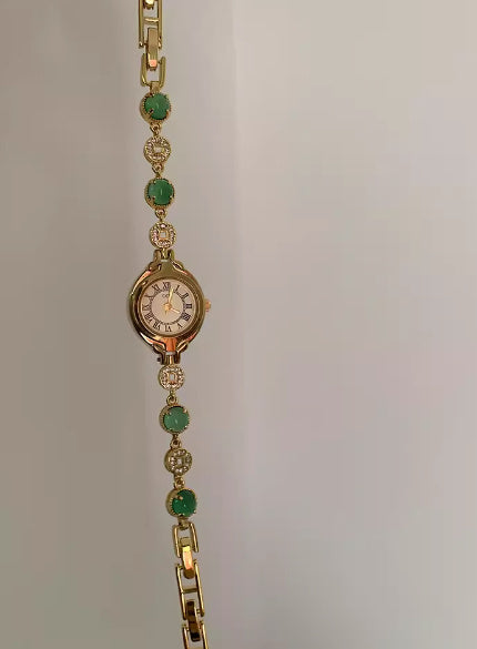 Reloj de cuarzo con diseño de interés especial en color esmeralda