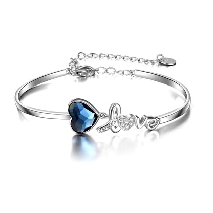 Pulsera de plata de ley bañada en oro blanco con cristales azules de Austria y corazón de amor