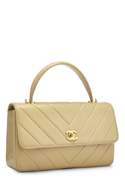 Chanel, sac à main en cuir d'agneau beige à chevrons d'occasion, beige