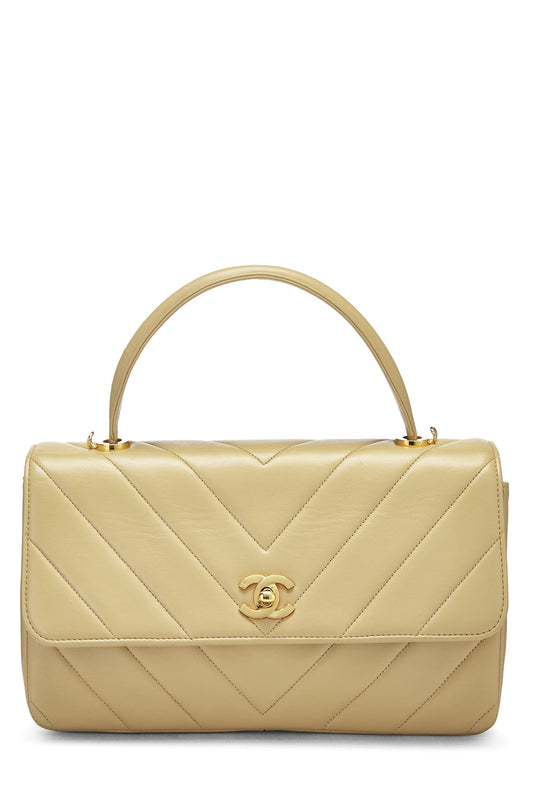 Chanel, sac à main en cuir d'agneau beige à chevrons d'occasion, beige