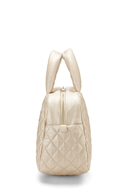 Chanel, Bolso bowling Coco Cocoon de cuero dorado Pre-Loved, Dorado