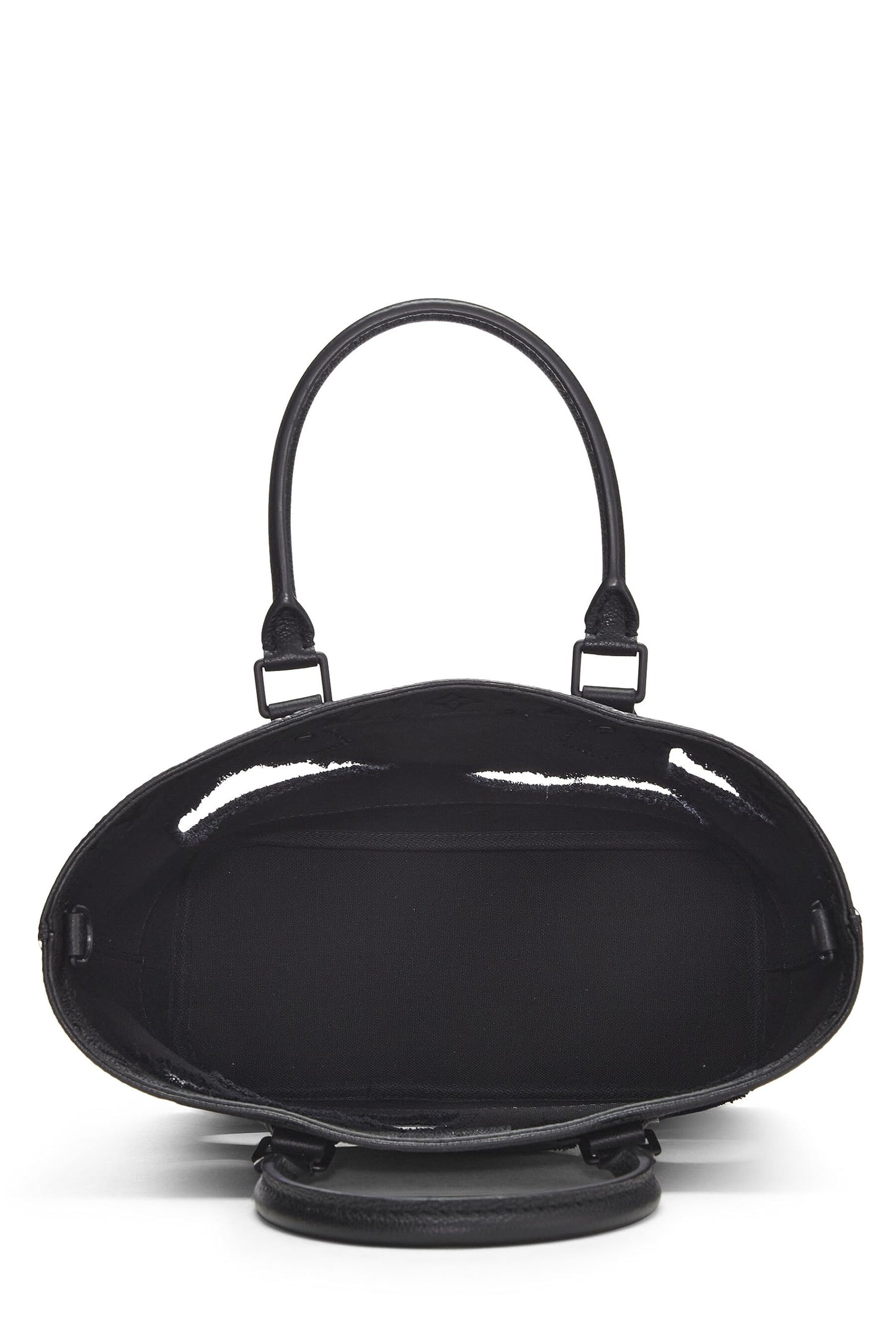 Louis Vuitton, Sac Empreinte monogramme noir avec trous COMME DES GARÇONS x Louis Vuitton pré-aimé, Noir