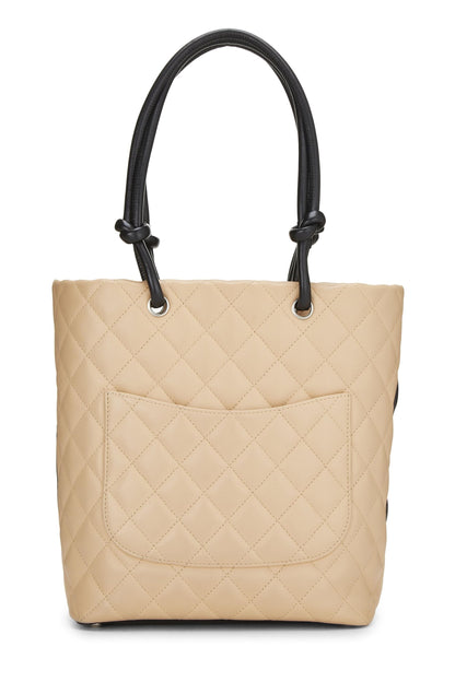 Chanel, sac cabas Cambon Ligne en cuir de veau matelassé beige d'occasion, petit modèle, beige