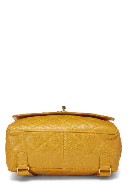 Chanel, sac à dos matelassé jaune caviar d'occasion, jaune