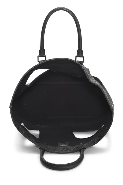 Louis Vuitton, Pre-Loved COMME DES GARÇONS x Louis Vuitton Bolso Empreinte con monograma negro y agujeros, Negro