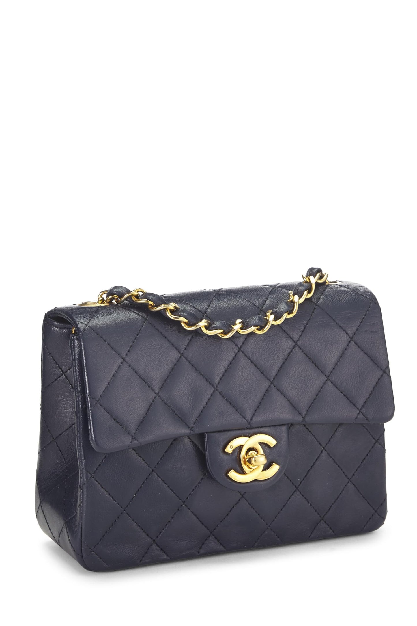 Chanel, Mini sac à rabat en cuir d'agneau matelassé bleu marine d'occasion, bleu marine