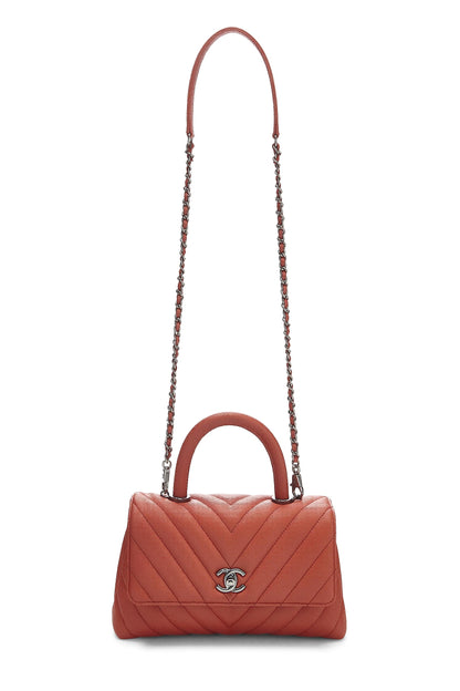 Chanel, sac à poignée en coco caviar orange chevron petit modèle d'occasion, orange