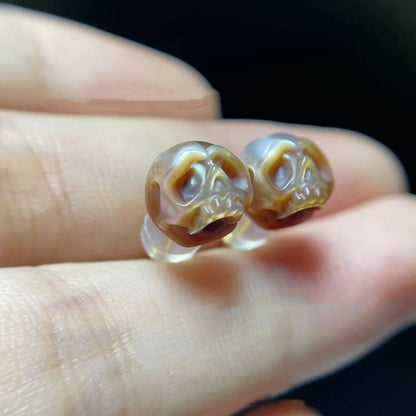 Pendientes de calavera con perla tallada