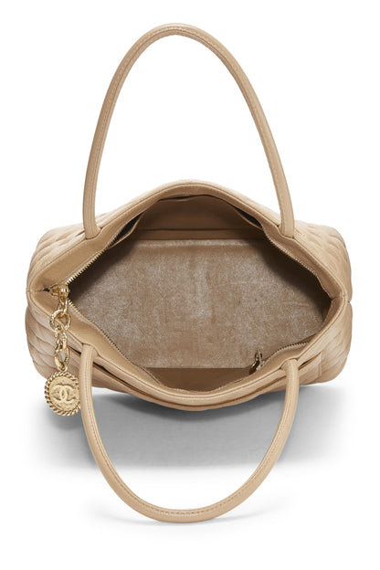 Chanel, Bolso tote con medallón de caviar acolchado beige Pre-Loved, Beige