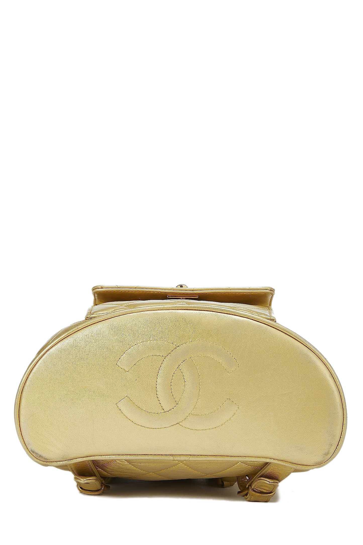 Chanel, Mini sac à dos classique en cuir matelassé métallisé doré d'occasion, doré