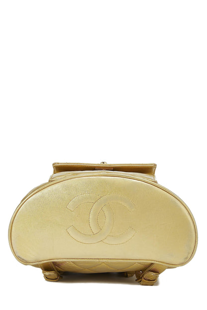 Chanel, Mini sac à dos classique en cuir matelassé métallisé doré d'occasion, doré