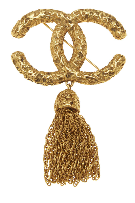 Chanel, broche à pompon « CC » en or d'occasion, or