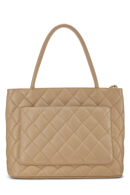 Chanel, sac fourre-tout matelassé à médaillon en caviar beige d'occasion, beige