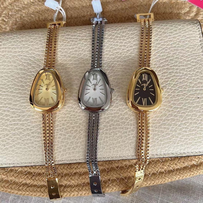 Montre à quartz pour femme avec chaîne à pompon de haute qualité et tête de serpent