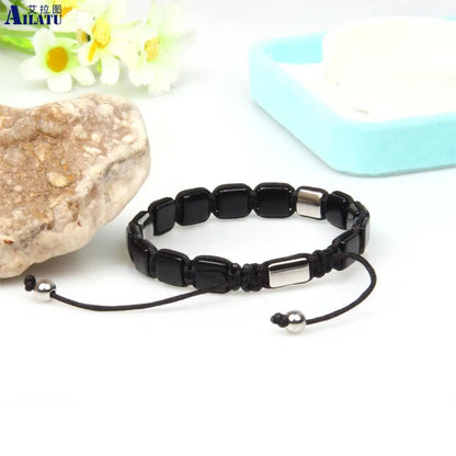 Ailatu - Pulsera trenzada de cuentas planas cuadradas para hombre, 10 unidades, con cuentas de piedra de ónix negro natural de 8 x 8 mm, logotipo de acero inoxidable