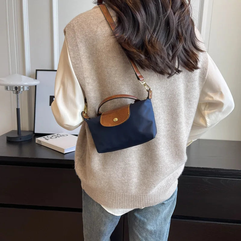 Tendencia de moda retro Cientos de bolsos cruzados de hombro para mujer 2024 Principios de primavera Nuevo bolso de mano de sensación premium extranjera de nicho