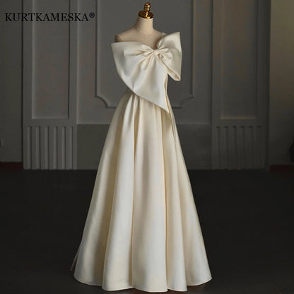 Robe longue élégante de soirée pour femme, tenue de soirée, de bal, d'invité, sexy, asymétrique, épaule dénudée, gros nœud, robe longue d'anniversaire, de remise de diplôme, été 2023