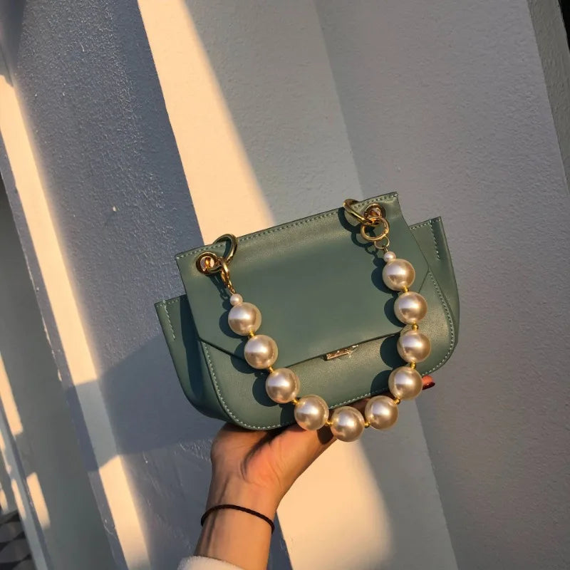 Nuevo bolso de mano exquisito con cuentas de perlas, estilo avanzado, combina con todo, para primavera y verano, para uso diario, minibolsos coreanos, paquete simple para mujeres