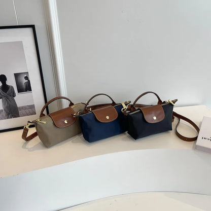 Tendencia de moda retro Cientos de bolsos cruzados de hombro para mujer 2024 Principios de primavera Nuevo bolso de mano de sensación premium extranjera de nicho