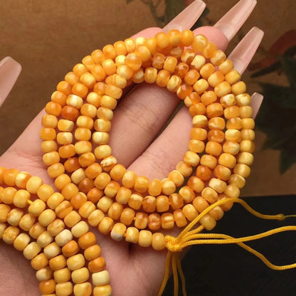 Collar y pulsera de varias vueltas con cuentas de Buda hechas de cera de abejas natural