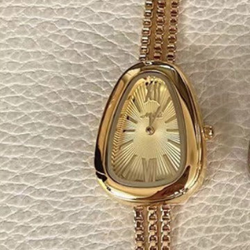 Montre à quartz pour femme avec chaîne à pompon de haute qualité et tête de serpent