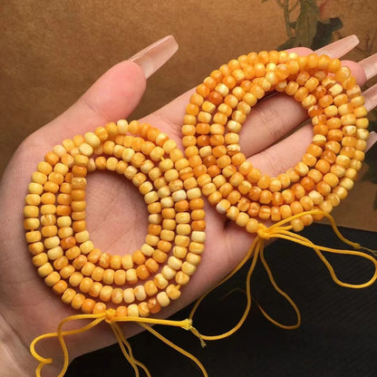 Collar y pulsera de varias vueltas con cuentas de Buda hechas de cera de abejas natural