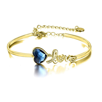 Pulsera de plata de ley bañada en oro blanco con cristales azules de Austria y corazón de amor